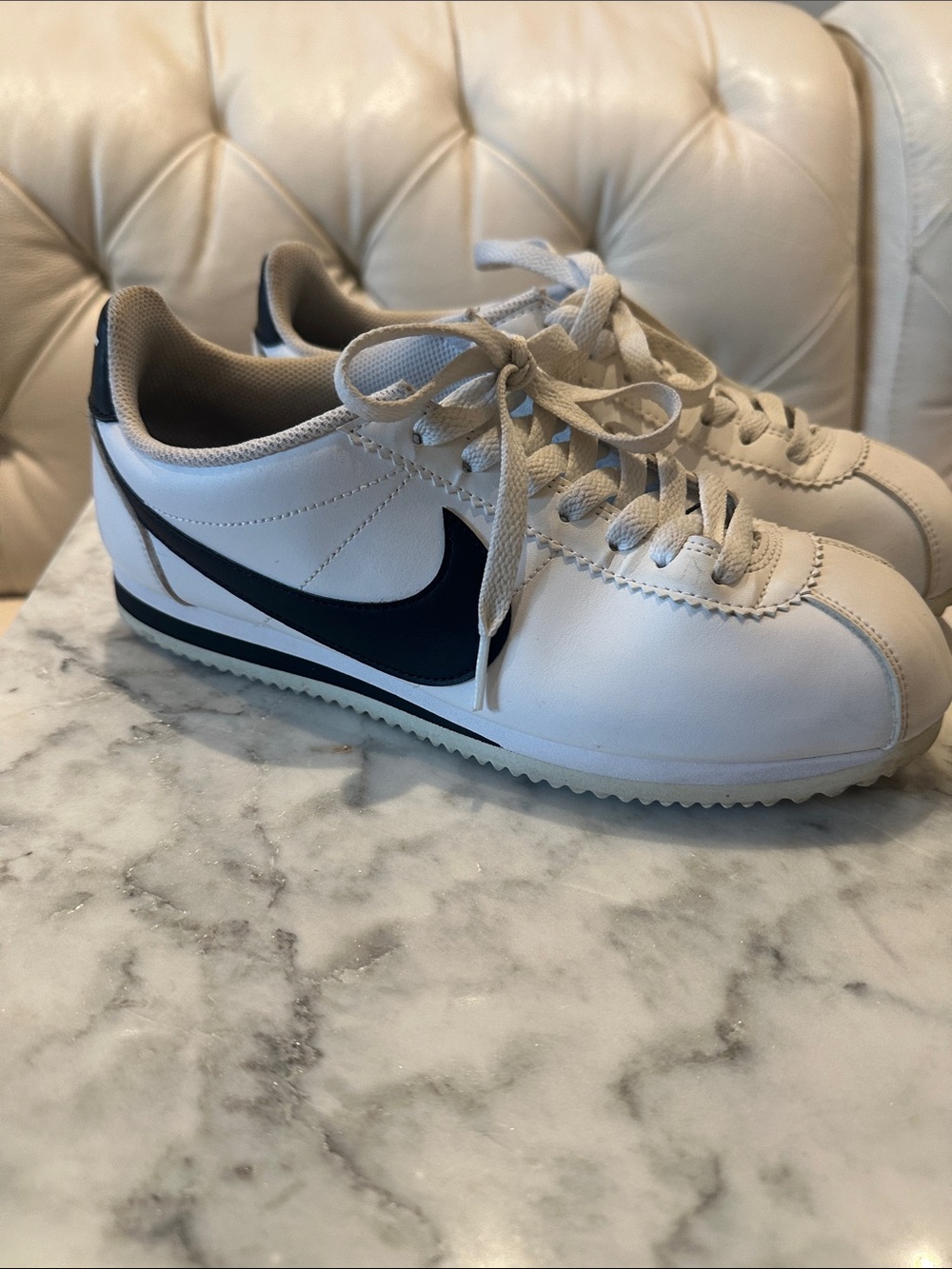 Nike White Sneakers with Black Swoosh Accent